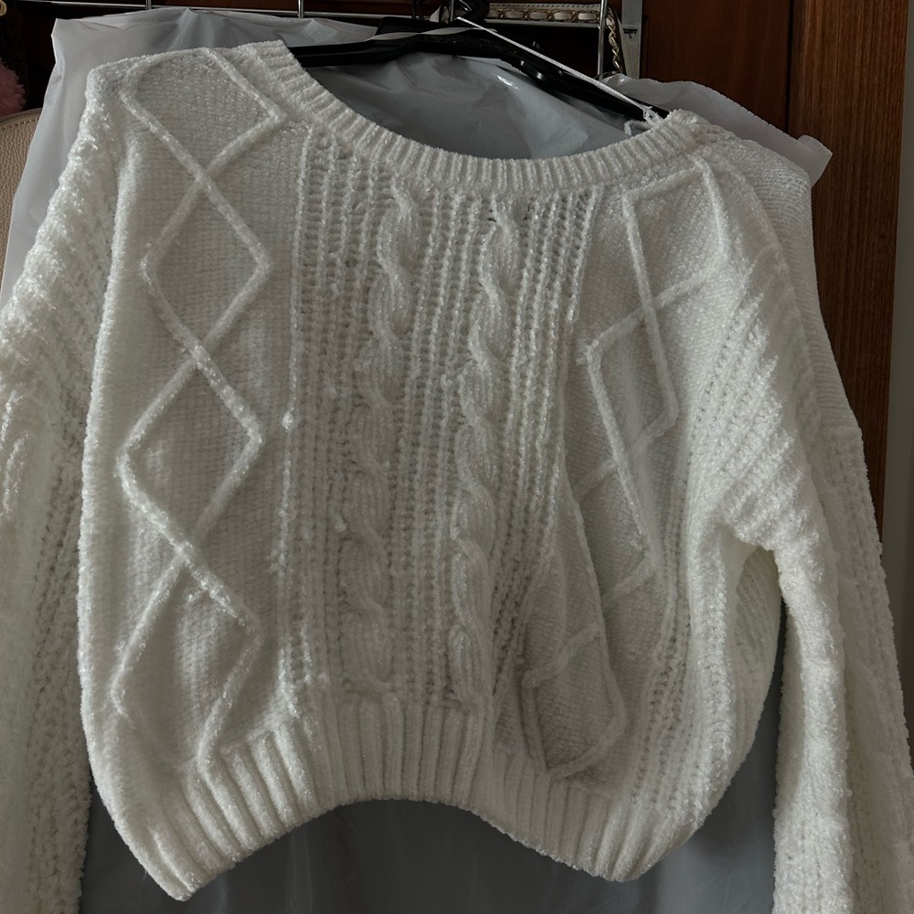 Selling this size small, white long sleeve sweater.